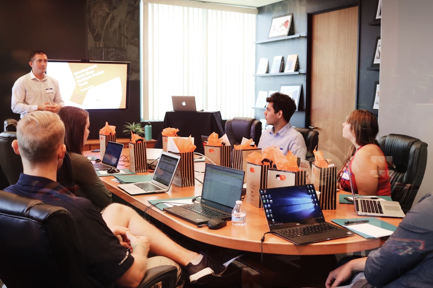 Professional team analyzing financial data on screens